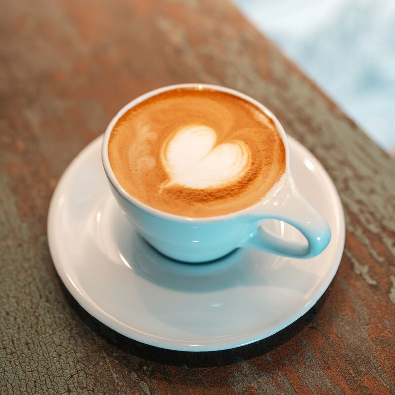 cappuccino in saucer with latte art heart