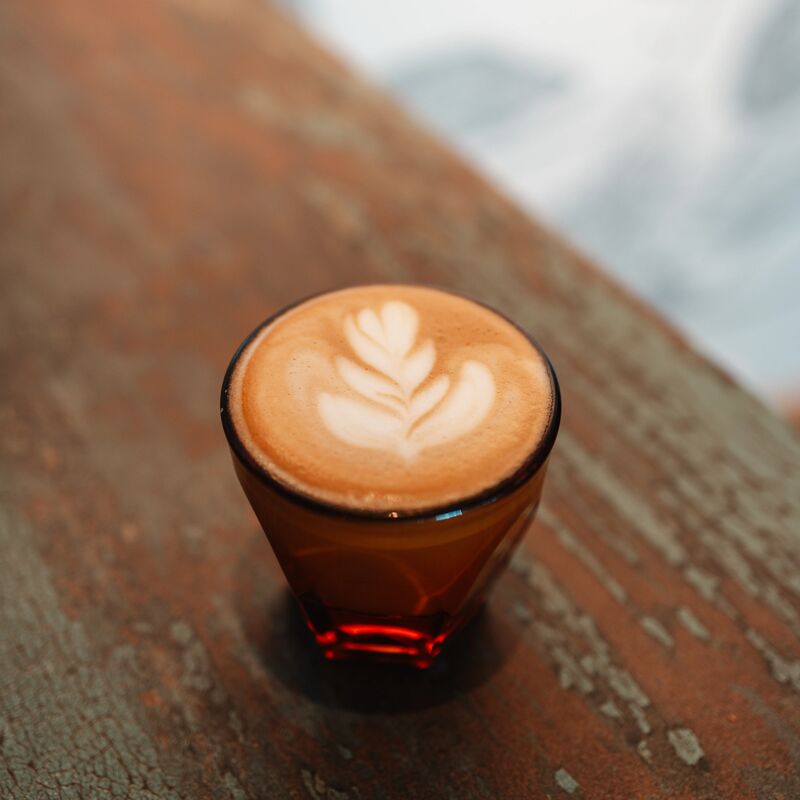 Cortado coffee with latte art leaf